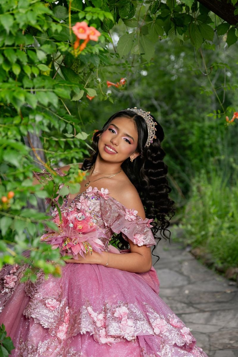Quinceañera portrait among flowers